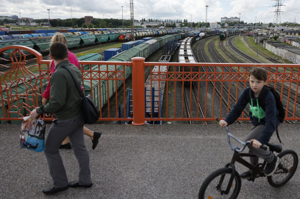 People on a bridge over rail tracks in Kaliningrad, Russia. Twix was thrown out of a train by an attendant.