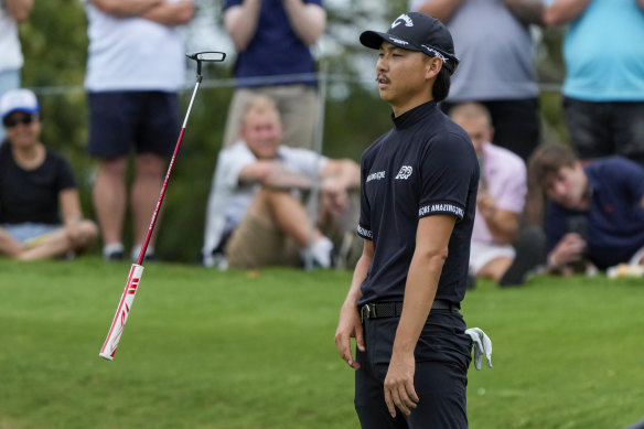 Min Woo Lee reacts after missing a birdie putt on the eighth earlier.