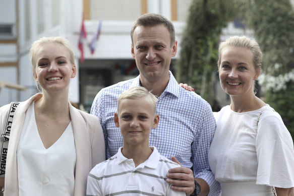 Alexei Navalny, with his wife Yulia (right), daughter Daria, and son Zakhar  in Moscow in 2019.