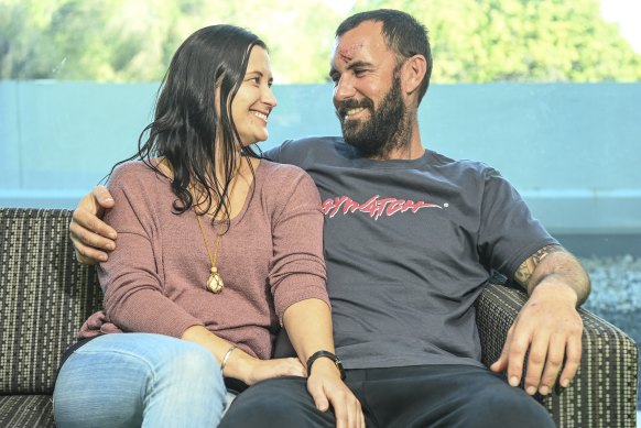 WA man Glenn Anderson, with partner Tracy Walker, who swam at least five kilometres to shore with his 11-year-old daughter Ruby after their yacht sank after being hit by a wave near Jurien Bay.