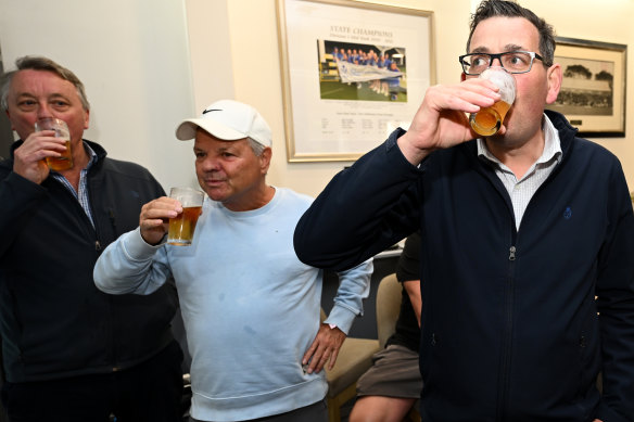 Daniel Andrews has a beer with members during a visit to Port Melbourne Bowling Club on Friday.