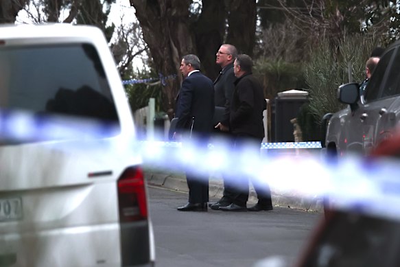 Detectives at the crime scene on Wednesday morning.