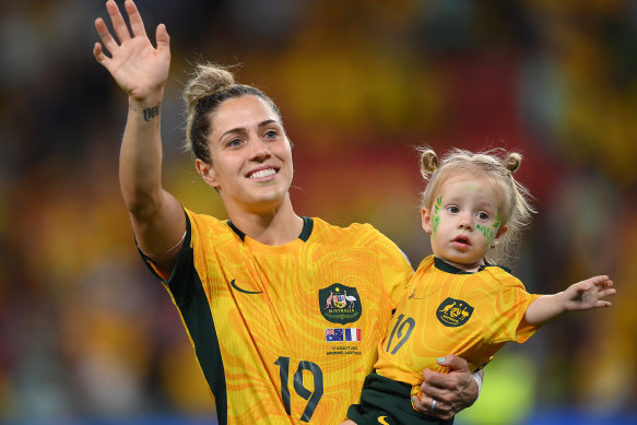 Katrina Gorry with her daughter Harper after Australia’s win on Saturday night.