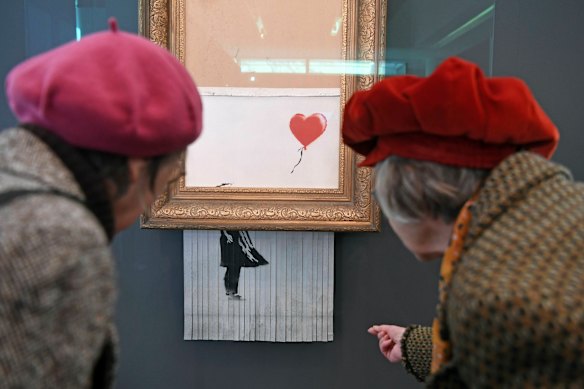 Banksy’s Girl with Balloon was shredded in front of stunned auctioneers and bidders. The shredded painting was renamed Love is in the Bin.
