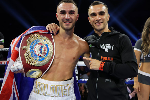 Jason Moloney (left) celebrates his world title win alongside twin brother Andrew.