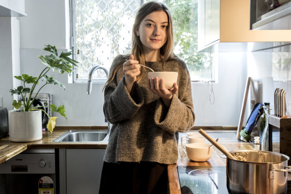 Zoe Swan-Duffy, 19, eating porridge. She tries to keep her food bill to $100 a week, including groceries and eating out.