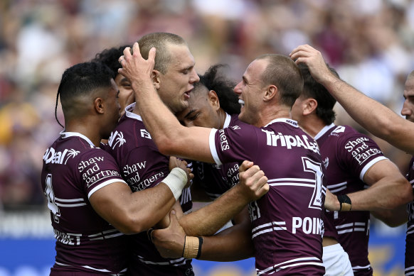 Daly Cherry-Evans celebrates Tom Trbojevic’s try against the Bulldogs.