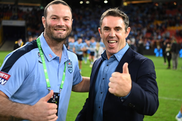 Boyd Cordner and Brad Fittler celebrate at Suncorp Stadium.