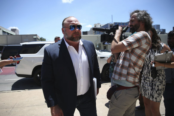 Alex Jones arrives at the Travis County Courthouse in Austin.