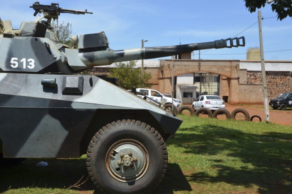 An armoured vehicle stands guard at Pedro Juan Caballero city jail in Paraguay following the jailbreak.