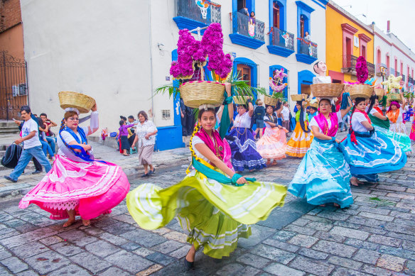Dancing in the streets of Oaxaca as part of Mexico’s Day of the Dead celebrations.