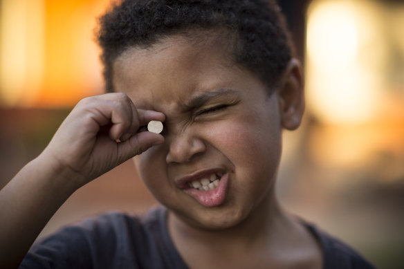 Three-year old Trent, pictured in 2018, swallowed a button battery like the one he is holding. 