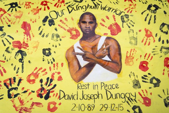 A banner of David Dungay Junior placed outside court during the inquest into his death.