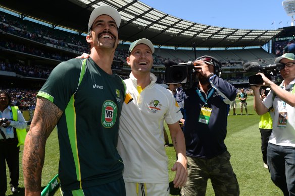 All smiles in public: Mitchell Johnson with Michael Clarke at the MCG during the 2013-14 Ashes series.