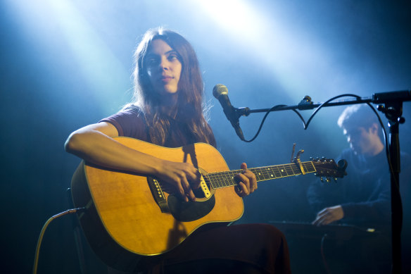 Julie Byrne performing on stage in Barcelona. 