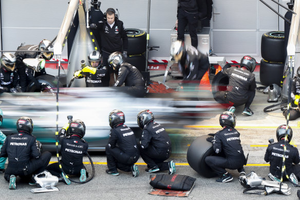 Lewis Hamilton's Mercedes-AMG Petronas car makes a pit stop during a Formula One pre-season testing at the Barcelona Catalunya racetrack.