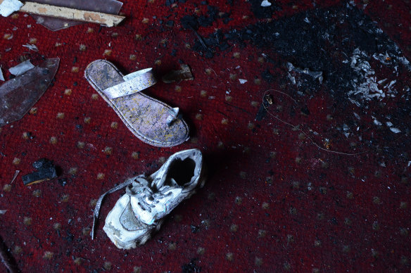 Abandoned shoes remain at the site of a fire inside the Abu Sefein Coptic church that killed dozens of people.