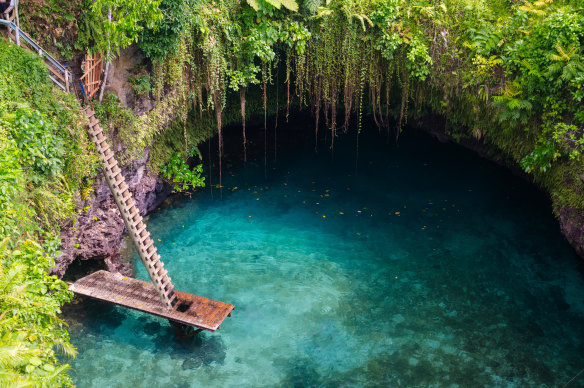 The spectacular To Sua Ocean Trench is reached by a ladder.