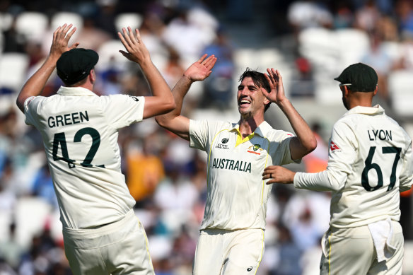 Pat Cummins celebrates taking the wicket of Cheteshwar Pujara on day four.