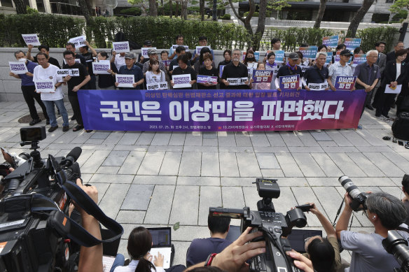 Representatives of bereaved family members of victims of the crowd crush gather to denounce the judgment.