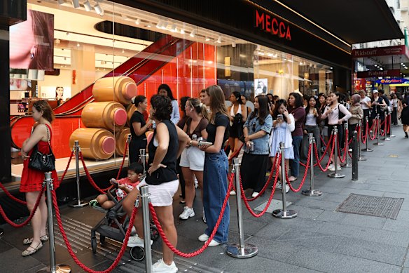 Excited shoppers line up at Mecca on George Street in Sydney to purchase from Hailey Bieber’s makeup brand, Rhode, which has just arrived in Australia.