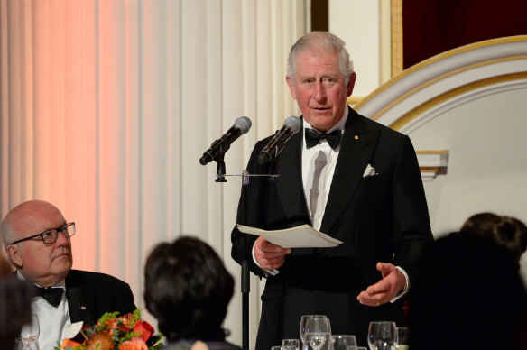 High Commissioner George Brandis watches Prince Charles make a speech at a dinner in aid of the Australian bushfire relief and recovery effort in London. 