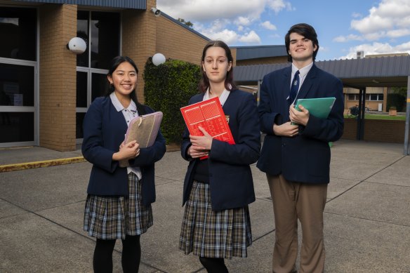 St Andrews College Marayong HSC students Caitlyn Dela Cruz and Cooper Shield have applied for early university offers. Nicola Gerardis (centre) plans to go into the workforce after completing year 12.