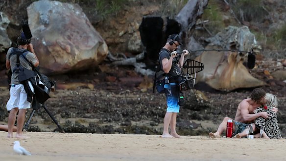 And they say romance is dead? Nick "Honey Badger" Cummins giving a peck on the cheek to a contestant while surrounded by crew during filming of The Bachelor this week.