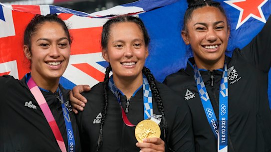 Olympic gold medallist Tyla Nathan-Wong (centre) and her teammates after winning gold at the 2020 Tokyo Olympics.