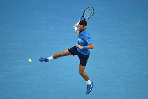 Novak Djokovic plays a forehand.