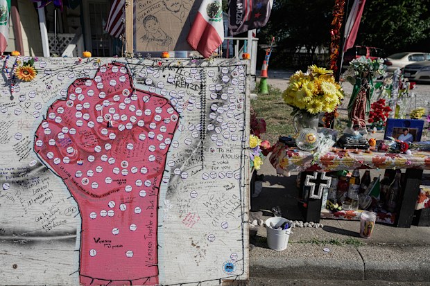 “I Voted” stickers are left at a memorial for Lorenzo Salgado Araujo.
