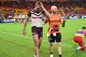 Oh no, not again: Tom Trbojevic leaves the field after suffering a reported hamstring injury.