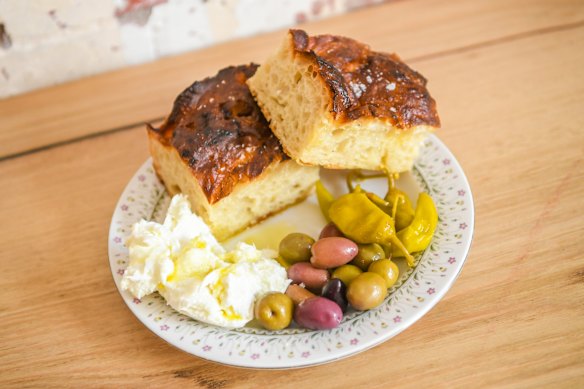 Focaccia served with olives, pickled chilli and torn burrata at Don's.