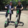 Lime's head of government relations Mitchell Price (left) and operations manager Ian Brouckaert with the Generation 3 scooter in Brisbane. 
