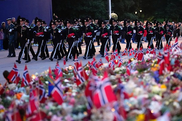 Honour guards attend a flag ceremony for Norway’s late King Harald at Palace Square in Oslo, Norway, Monday, Sept. 7, 2026.