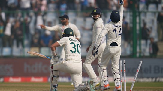 Indian players celebrate the dismissal of Australia’s Pat Cummins.