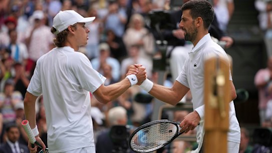 Serbia’s Novak Djokovic, right, greets Australia’s Alex de Minaur at the net after winning a fourth round men’s singles match at the Wimbledon Tennis Championships in London, Monday, July 7, 2025. (AP Photo/Kin Cheung)