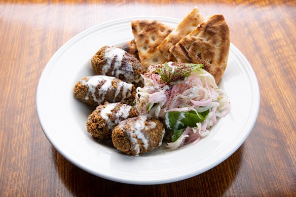 Falafels with babaghanoush, slaw and flatbread.