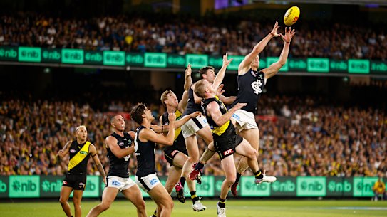 Carlton’s Tom De Koning flies for the ball in the 2023 season-opening match against Richmond.