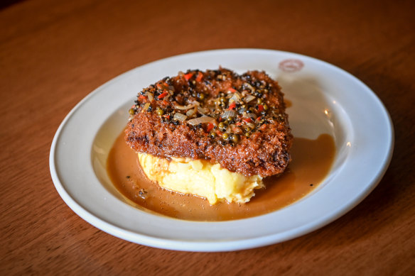 Kangaroo schnitzel with mash and pepper sauce at Punters Club.