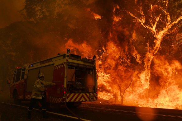 The Gospers Mountain fire crosses the Bells Line of Road at Berambing on Thursday. 