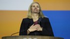 Kirsty Coventry reacts after she was announced as the new International Olympic Committee president.