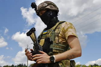 A Ukrainian serviceman guards in the village of Mayaky in the Donetsk region on Friday. 