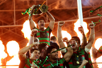 Then-South Sydney captain John Sutton with the NRL trophy in 2014.