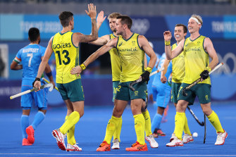 Blake Govers celebrates a goal with his Hockeyroos teammates.