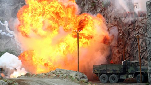 An explosion during a military demonstration targeting a theatrical "ballistic missile launchpad" at the International Defence Exhibition and Conference in Abu Dhabi on Sunday.
