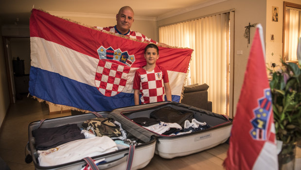 Croatia fans Robert Bobanovic and his son Karlo pack their bags for Zagreb, Croatia.