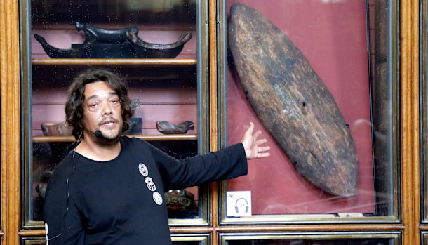 Rodney Kelly speaks in front of the Gweagal Shield at the British Museum.