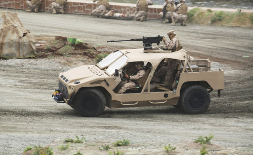 Soldiers demonstrate an attack vehicle at the International Defence Exhibition and Conference in Abu Dhabi on Sunday.