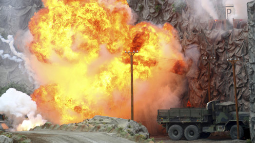 An explosion during a military demonstration targeting a theatrical "ballistic missile launchpad" at the International Defence Exhibition and Conference in Abu Dhabi on Sunday.